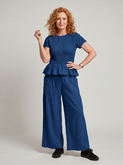 Eirenne | Peplum Detail Smocked Top And Wide Leg Pants Set